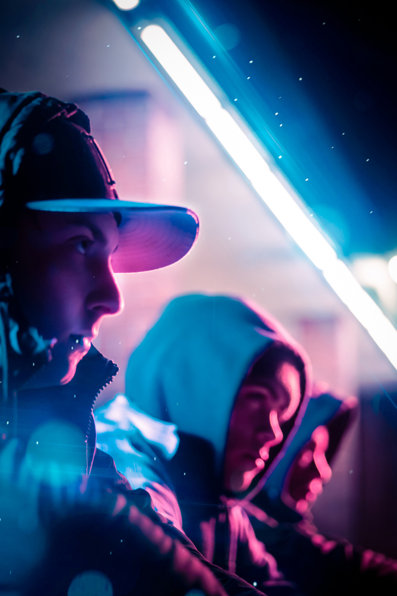Campaign portrait with dramatic cyan and magenta lighting